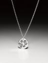 Silver chain with a small paw print pendant in silver